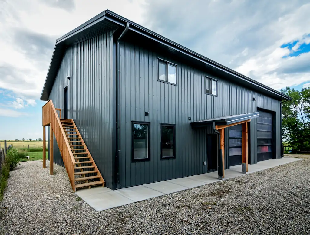 An exterior staircase on this post frame building designed to save space inside
