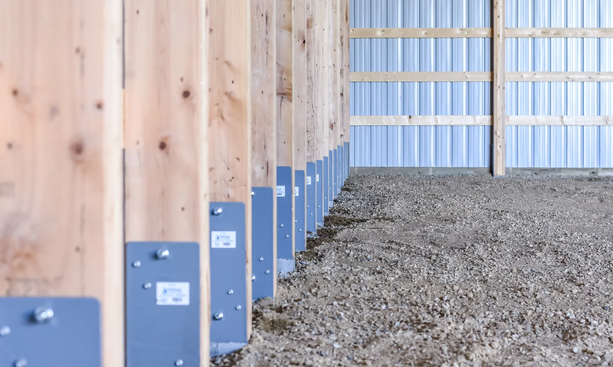 Close-up of engineered posts with Perma-Column that work as the sturdy, strong, durable foundation of a cold storage farm building.