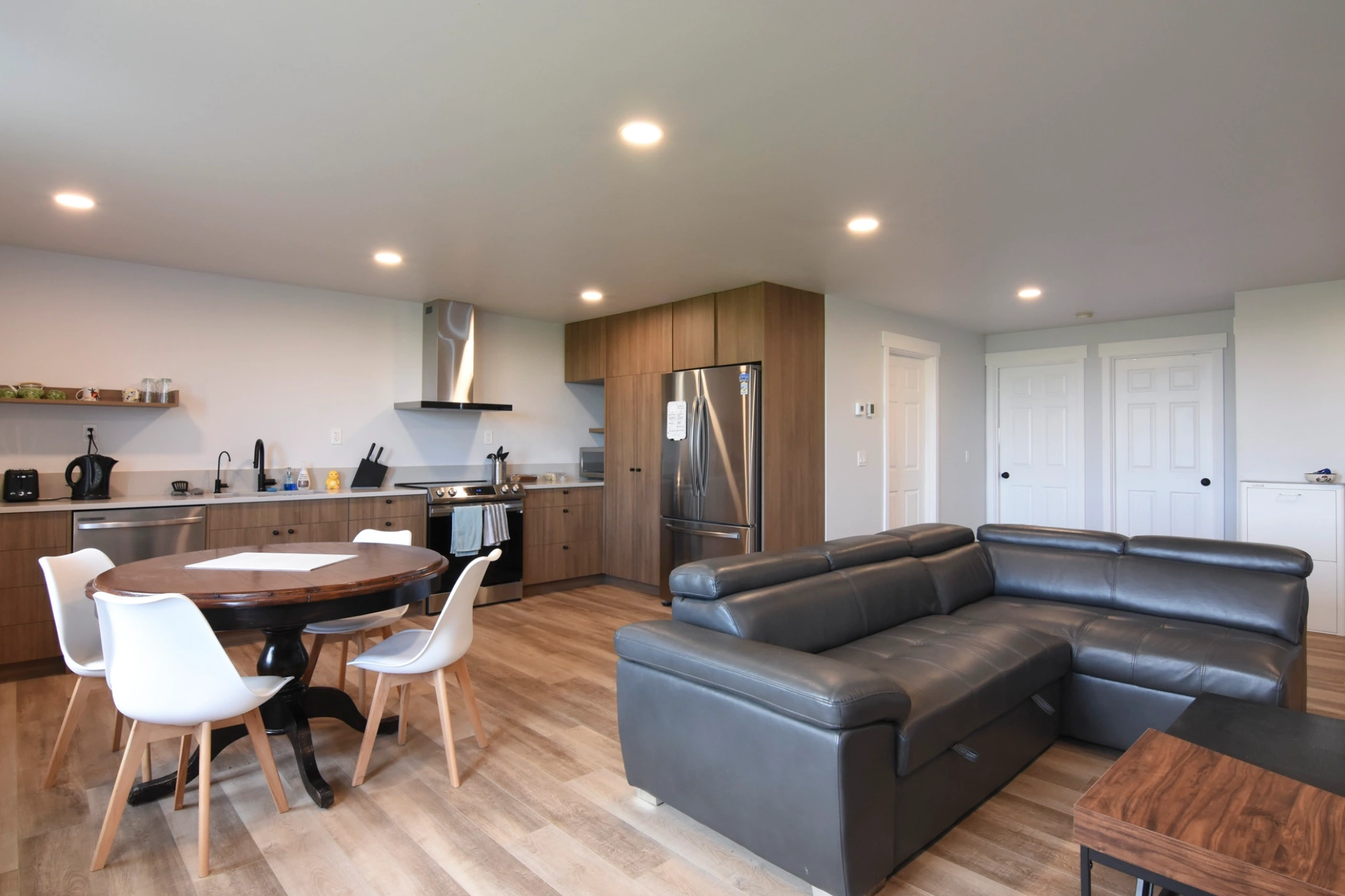 This post frame building with living quarters has a kitchen, bedroom, and living room.