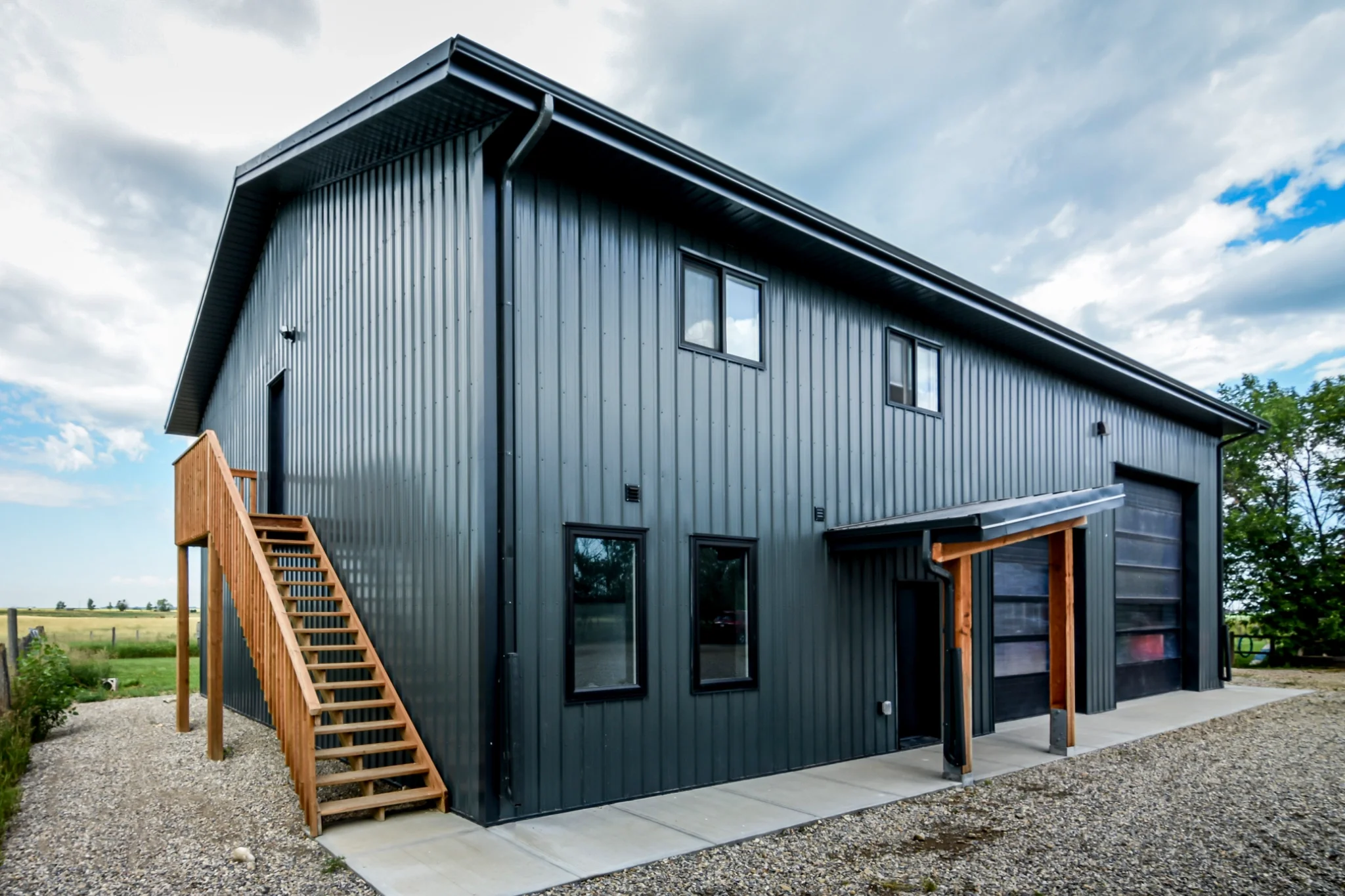 An exterior staircase on this post frame building save space inside for a fully finished living quarters