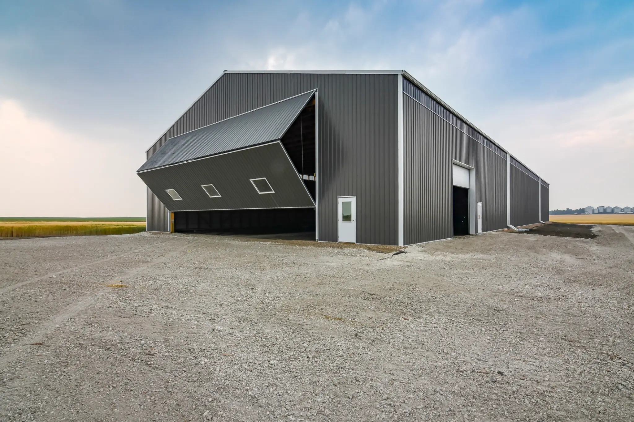 Opposing bi-fold doors give this cold storage for farm equipment building pull-through access for large farm machinery and implements.