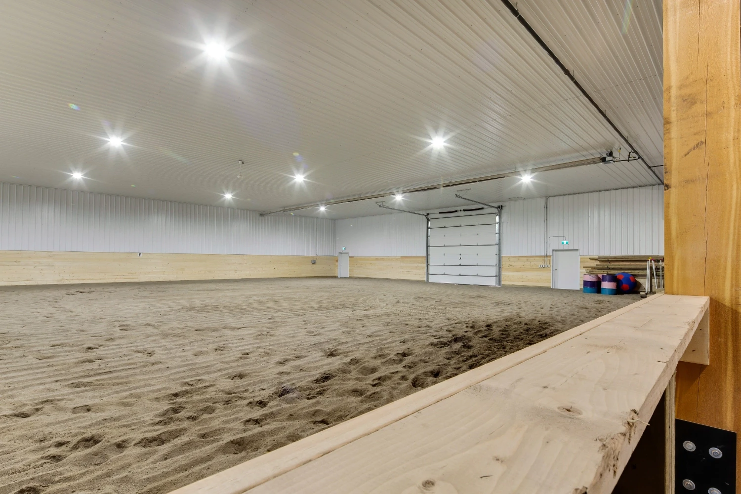 A shot shows what spectators see for the viewing area of a post frame indoor riding arena