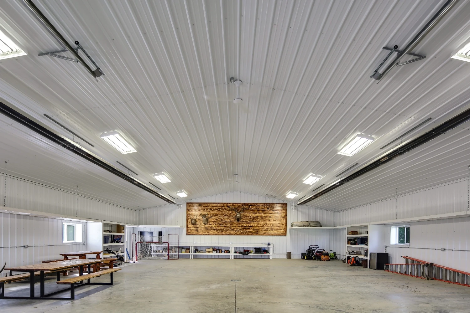 A monitor-style shop constructed with post frame methods create a clear span interior for flexible use.