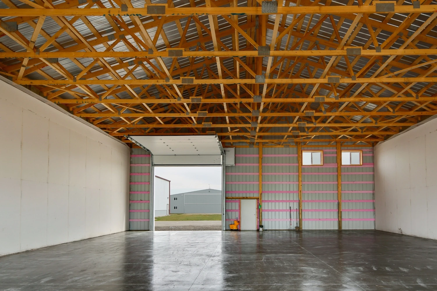 An unfinished interior of an airplane hangar to shelter planes from harsh weather.