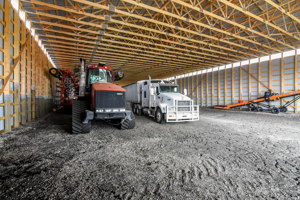 80' x 200' machine shed clear-span interior stores several pieces of agricultural equipment