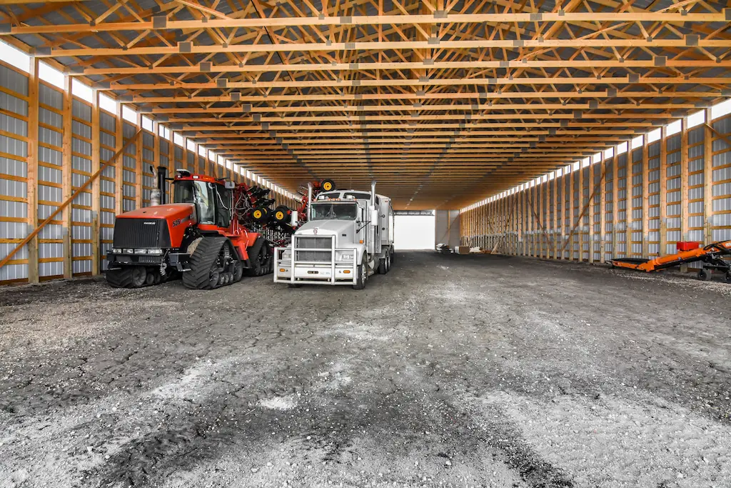 Tractor and grain cart parked inside 80' x 200' equipment cold storage building