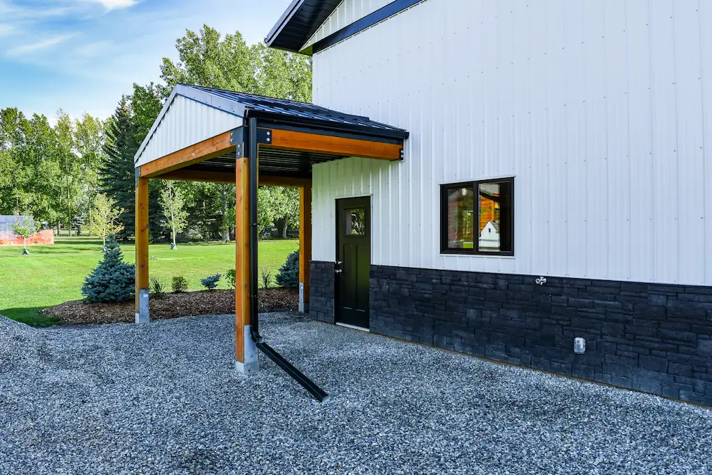 Covered porch leads into a 40' x 40' hobby shop with guest suite