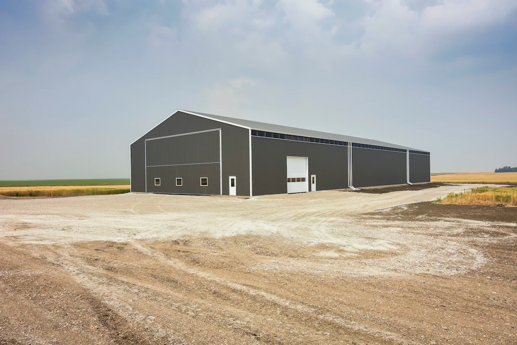 Durable post frame building serves as a cold storage building for farm equipment in Saskatchewan