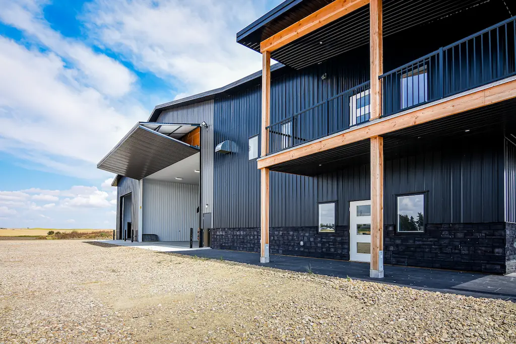 Bi-fold door opening on a farm building with wrap around porch