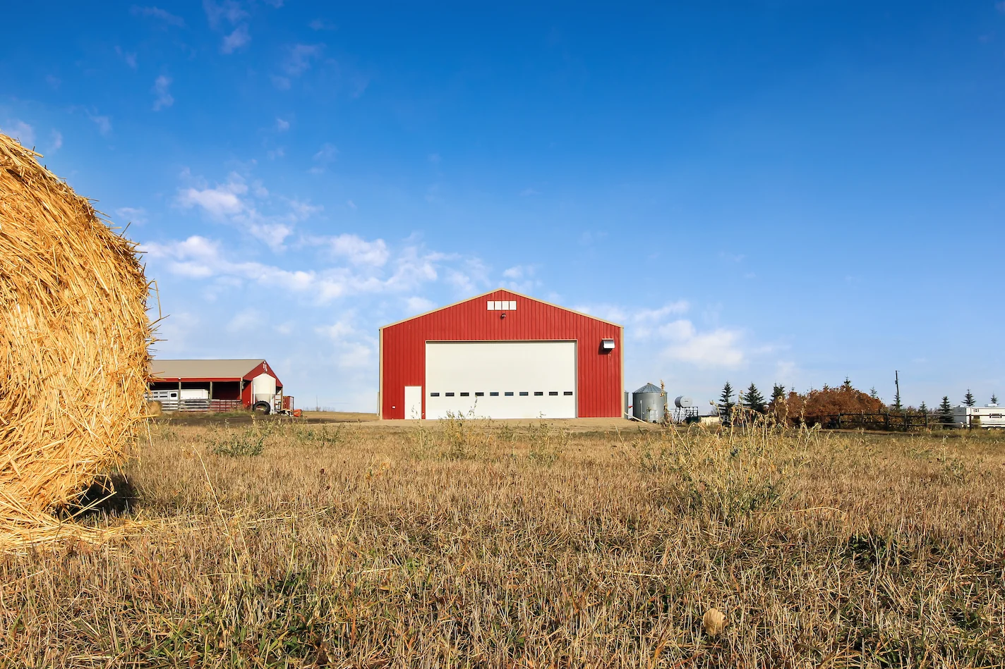 Two red farm buildings on an Alberta farm