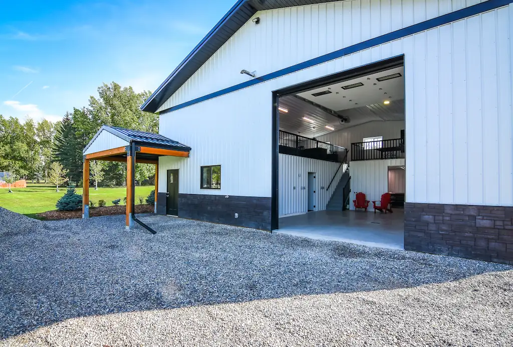 Inside of a hobby shop building can be seen through an open overhead door