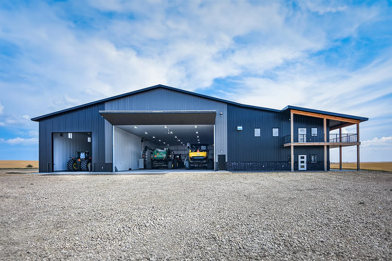 Insulated, heated farm shop with office and wash bay with farm equipment inside