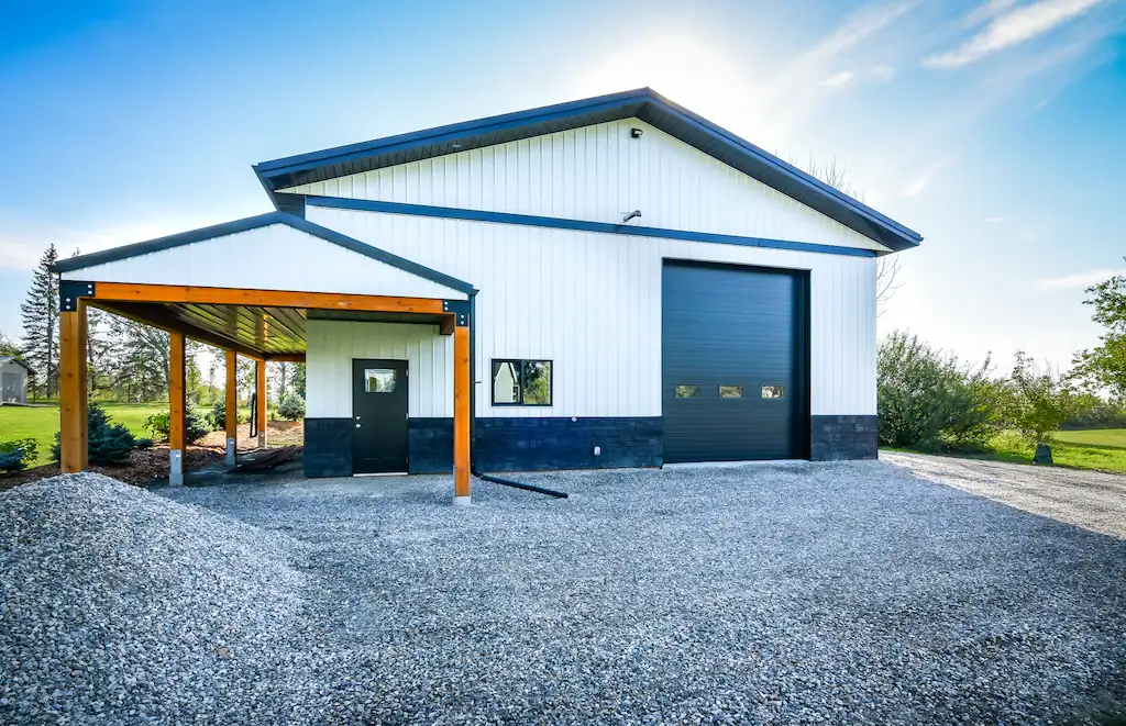 Exterior of 40' x 40' hobby shop with black overhead door