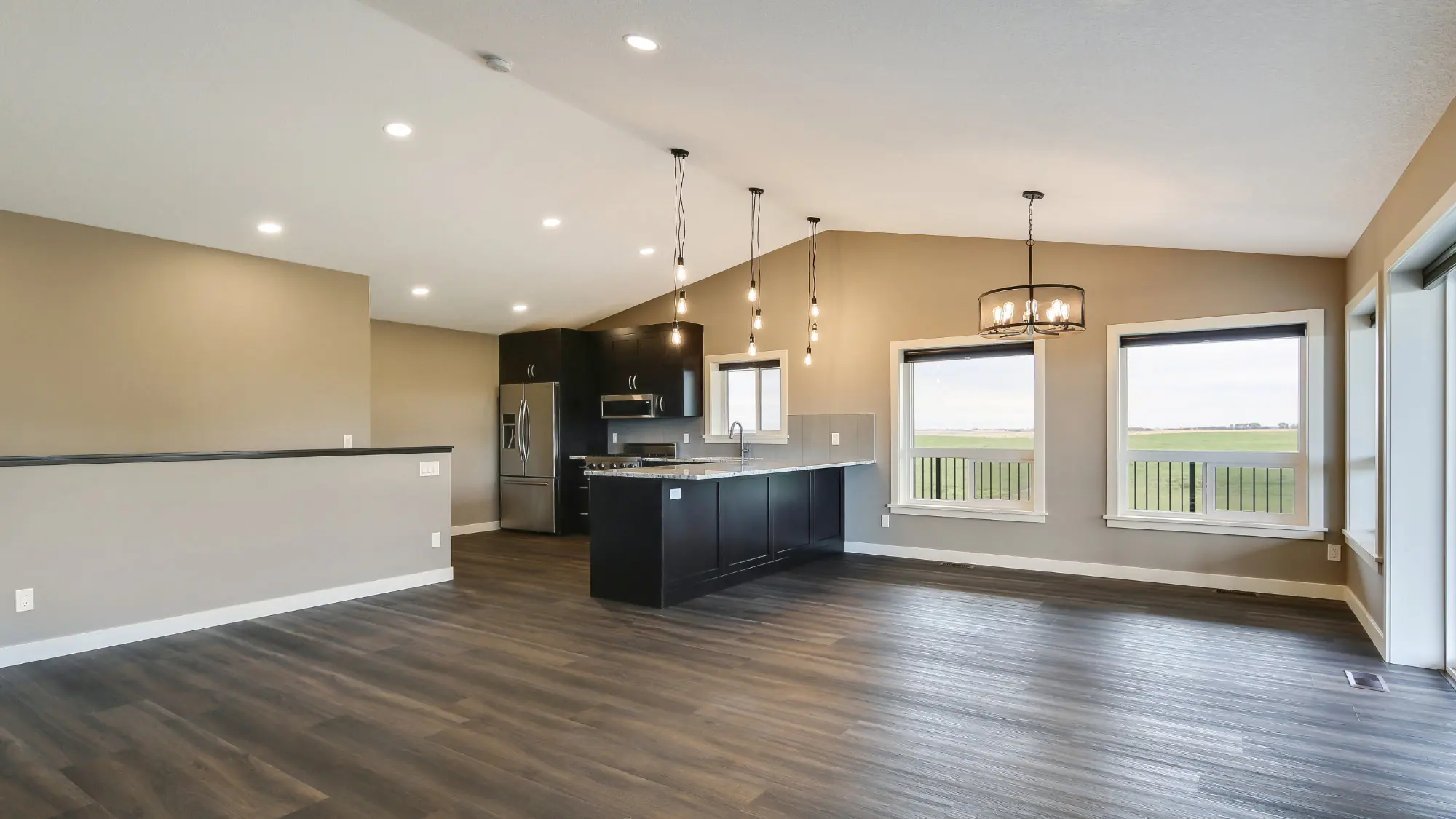 Kitchen and living space of an open-concept two story barndominium