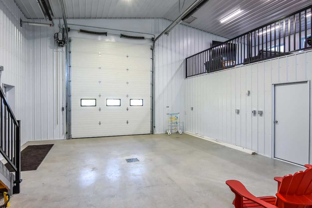Overhead door with built in windows creates bright interior inside a 40' x 40' shop