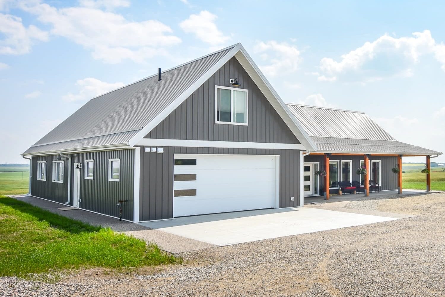 A post frame home with an attached garage for convenient storage and vehicles.