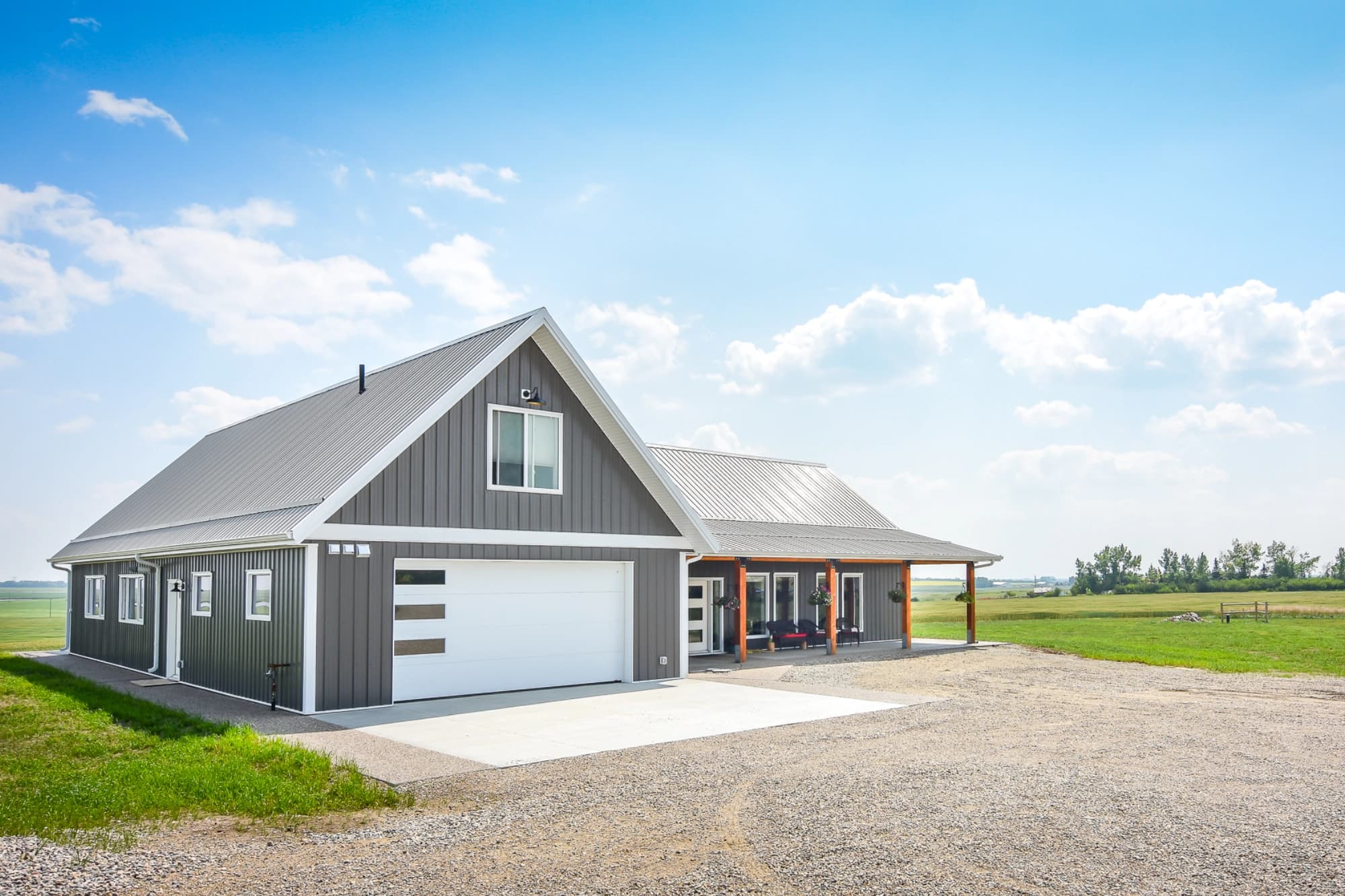 A post frame home with an attached garage for convenient storage and vehicles.