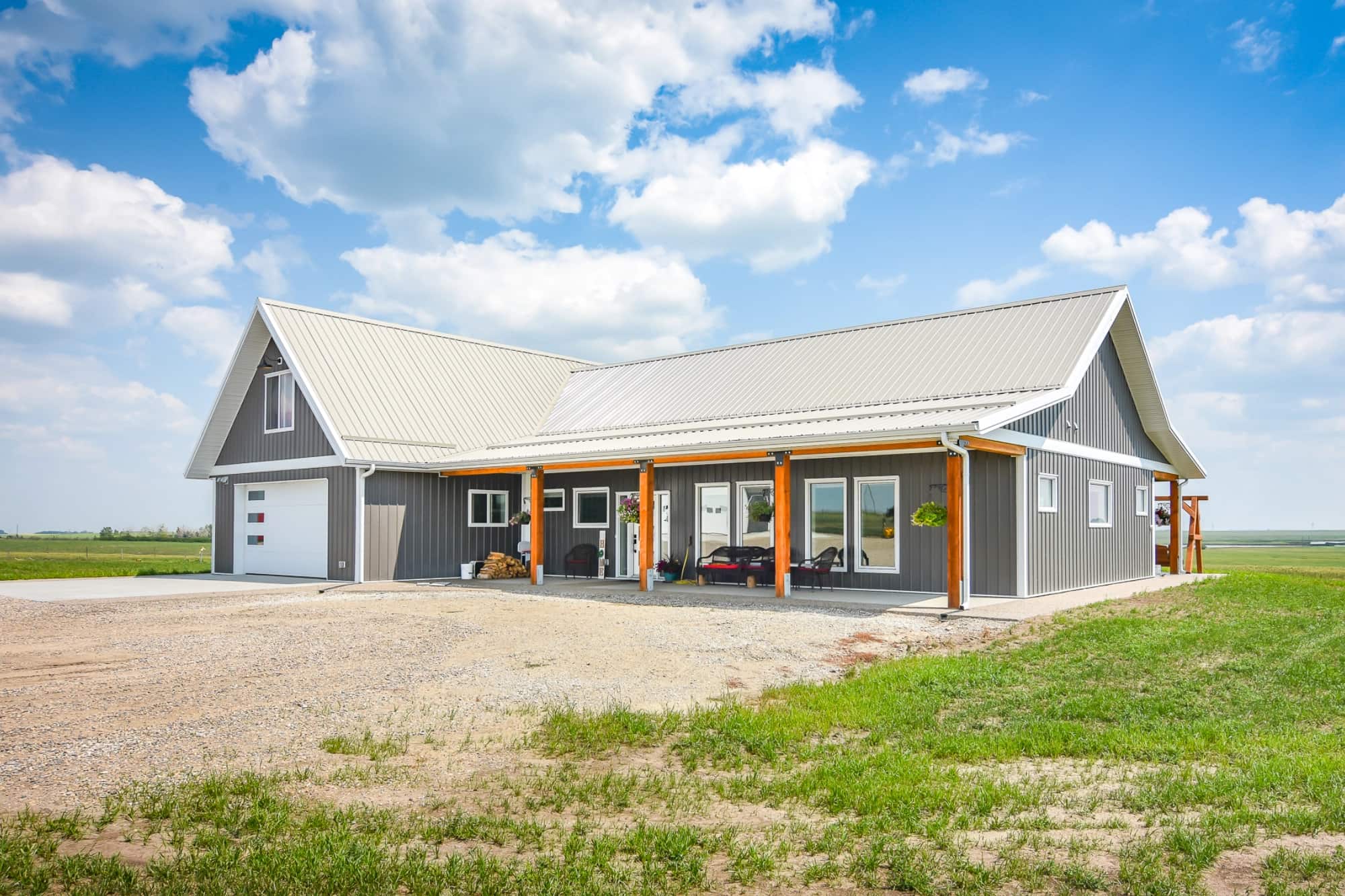 A detailed post frame home exterior with a myriad of features chosen to create a polished bungalow.