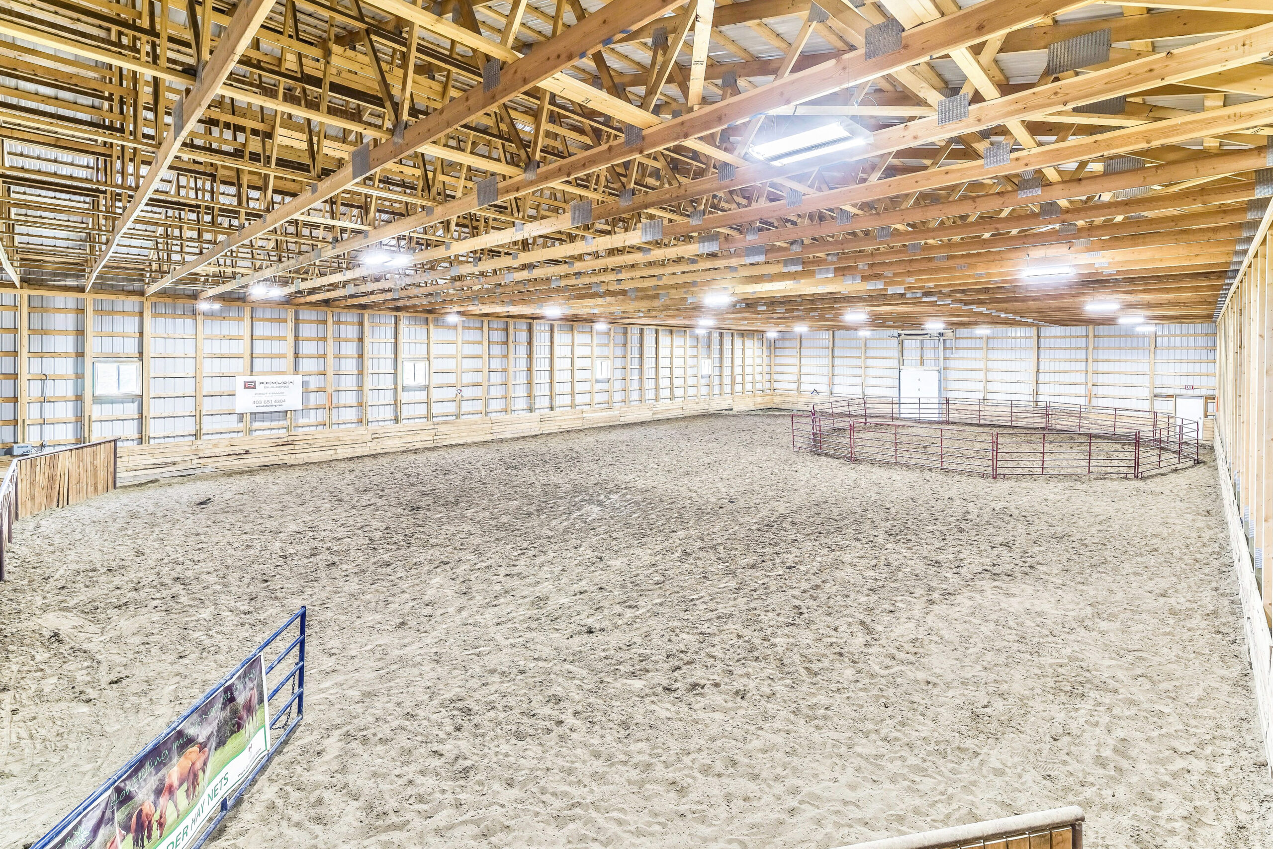Unfinished interior of a riding arena that's used as a training facility for horses