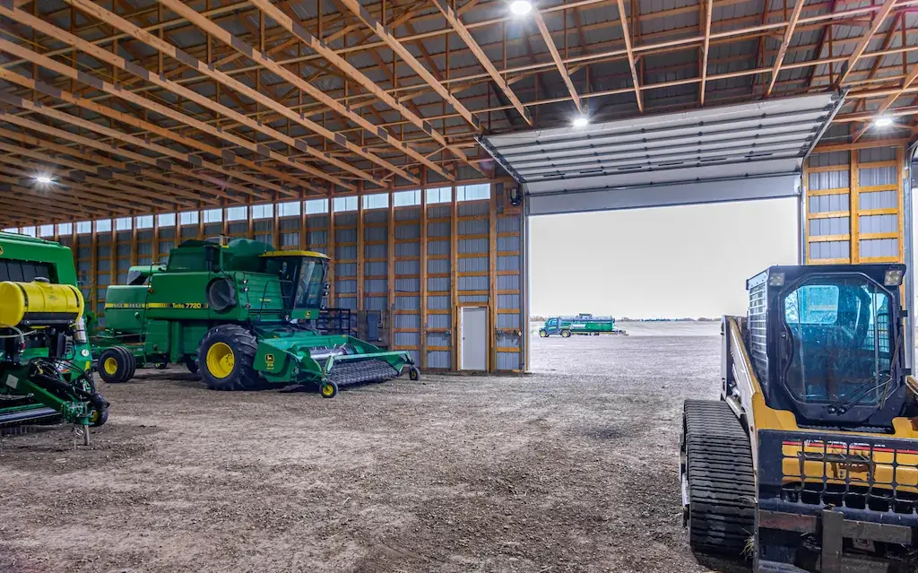 Engineered for strength, a post frame cold storage building has posts and trusses spaced at 4'