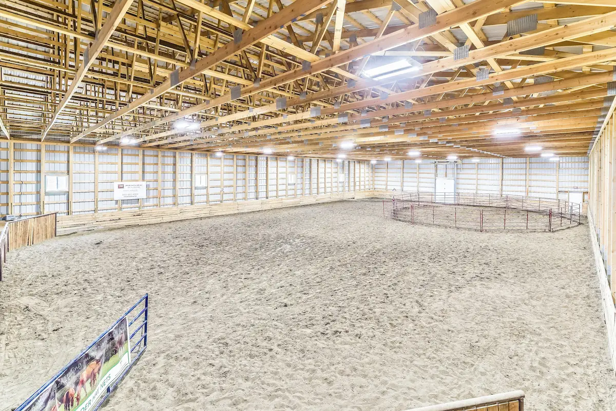 Indoor equestrian riding arena with 6' kickwall