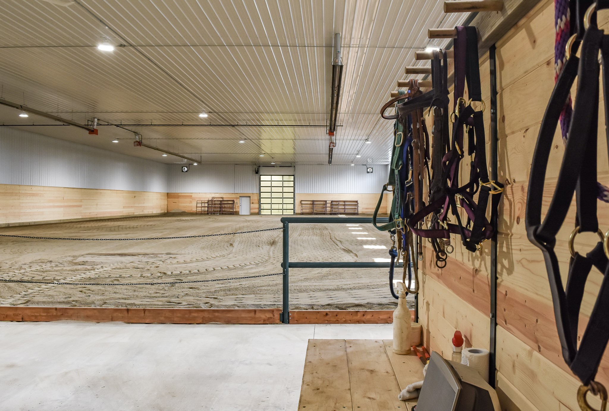 horse riding arena with durable materials and horse stalls