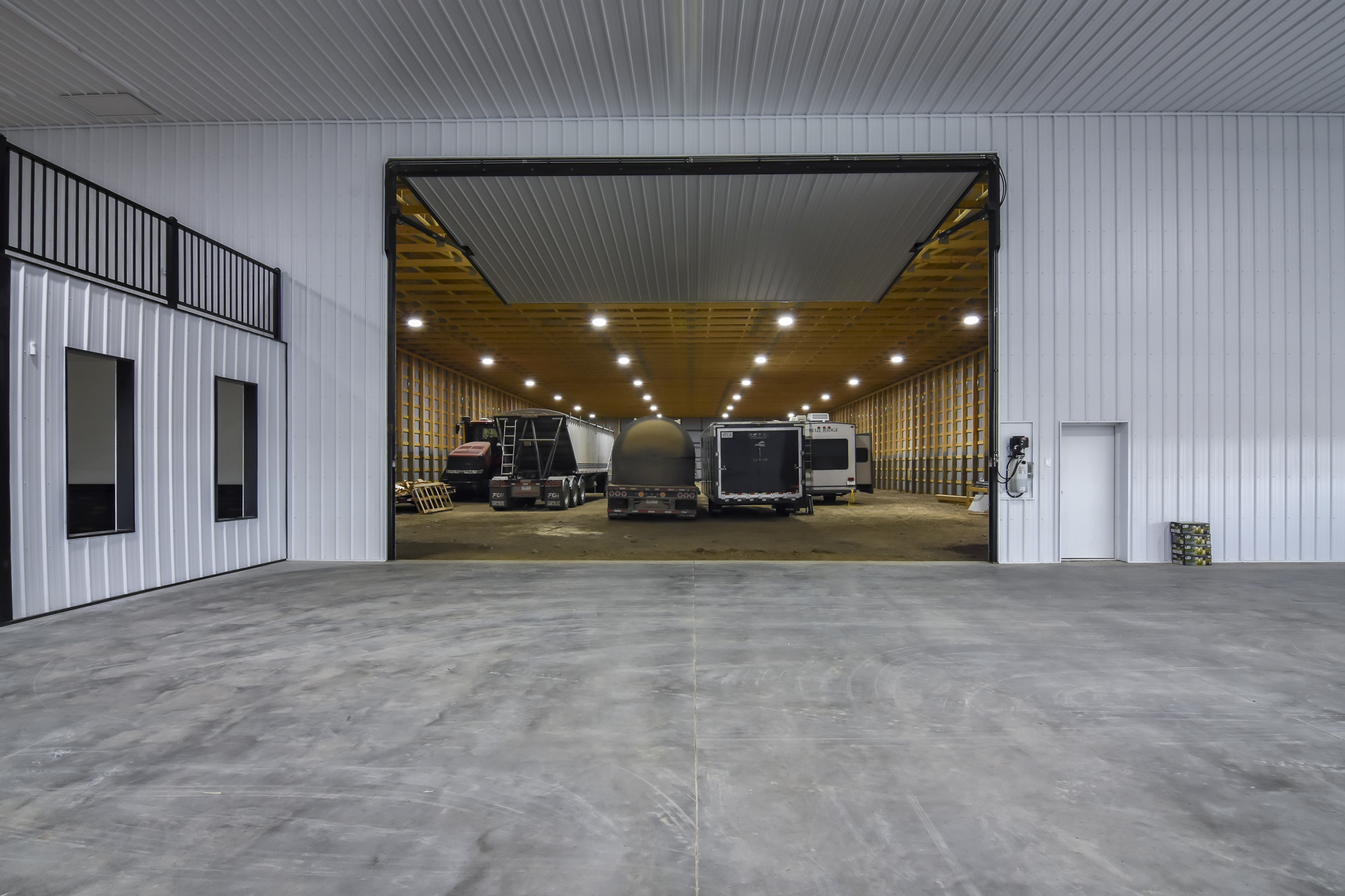 This farm shop features a large Powerlift door that connects the farm workshop to the machine shed