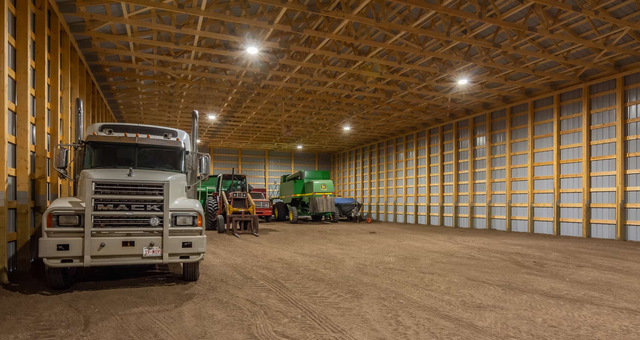 Inside a farm cold storage that has posts spaced closely together for optimum strength