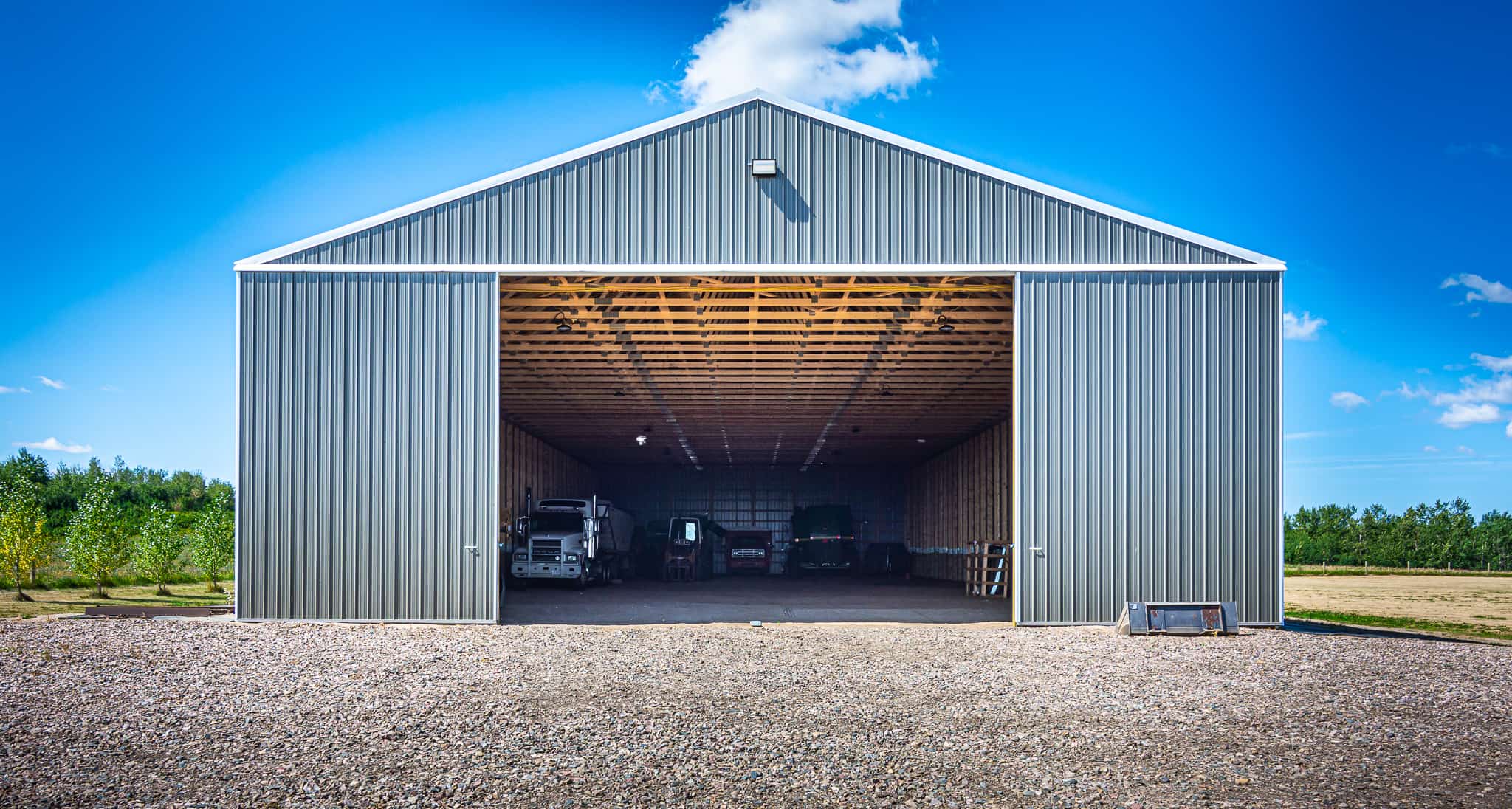 Inside a farm cold storage that has posts spaced closely together for optimum strength