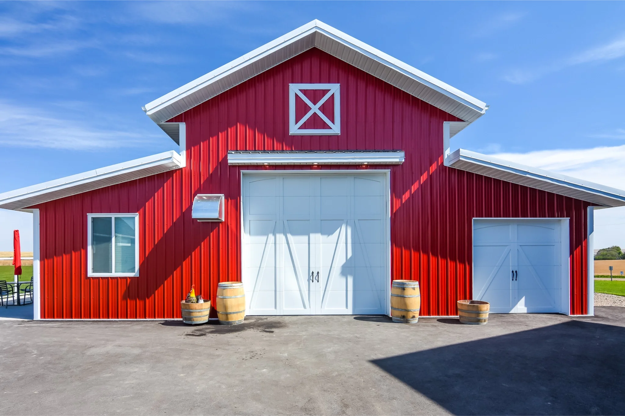 A red monitor hobby shop with elevated details for an upscale rural property.