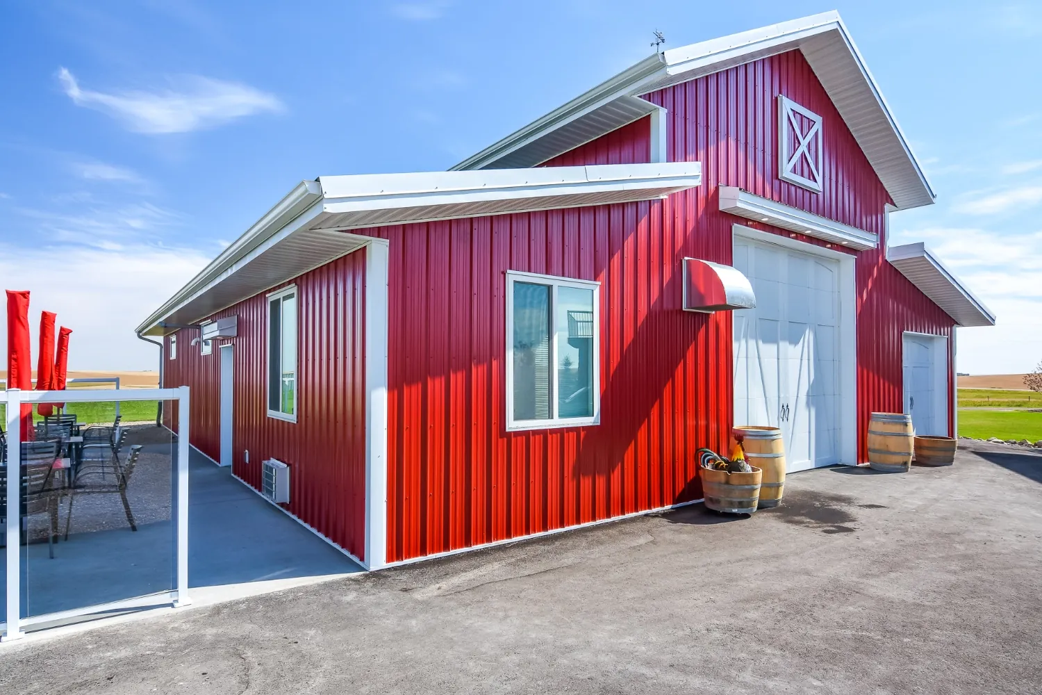 A sitting area outside a custom hobby shop creates a break area to enjoy the serene countryside.