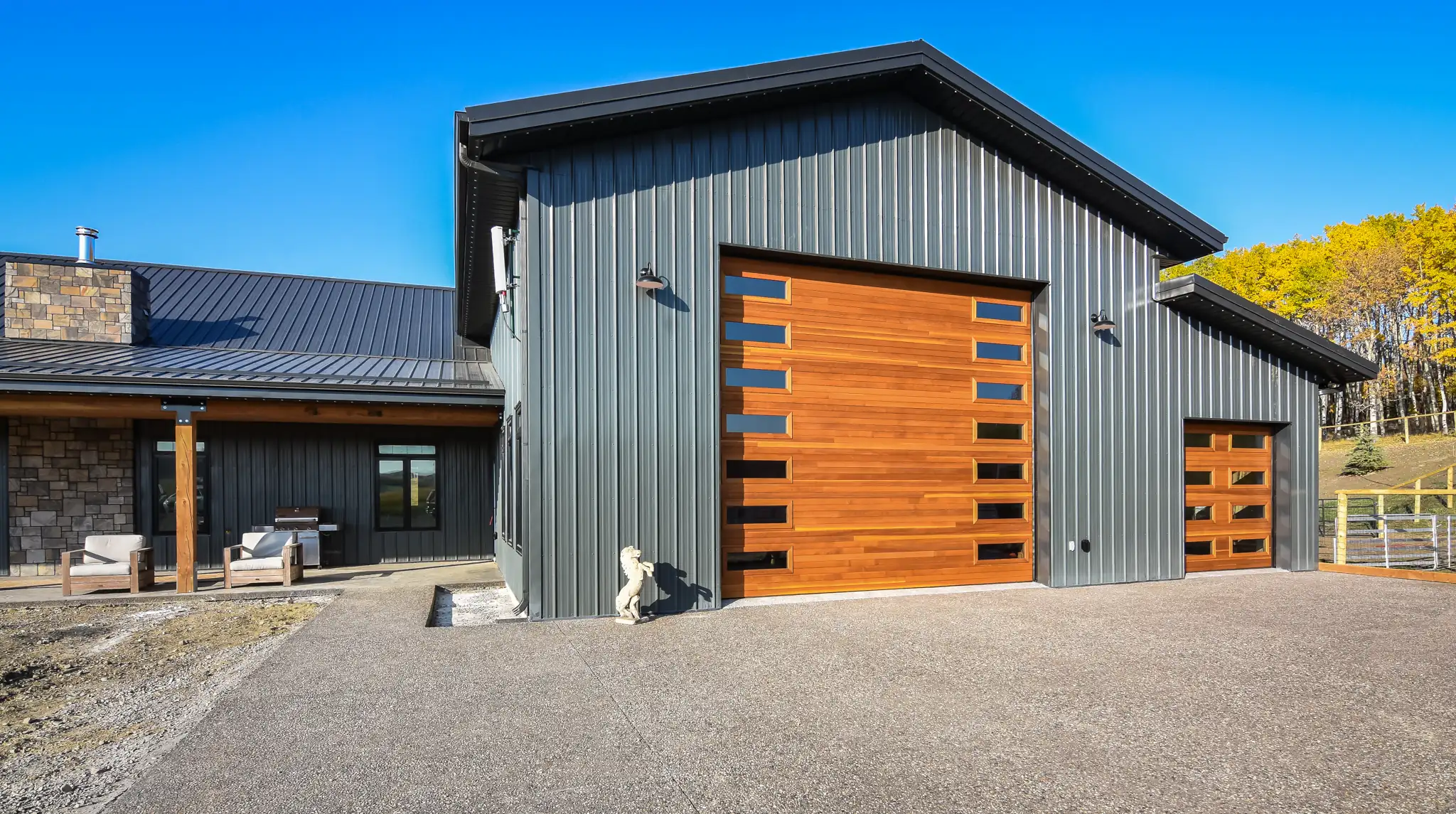 Small storage area sits to the right of the larger barndominium shop space.