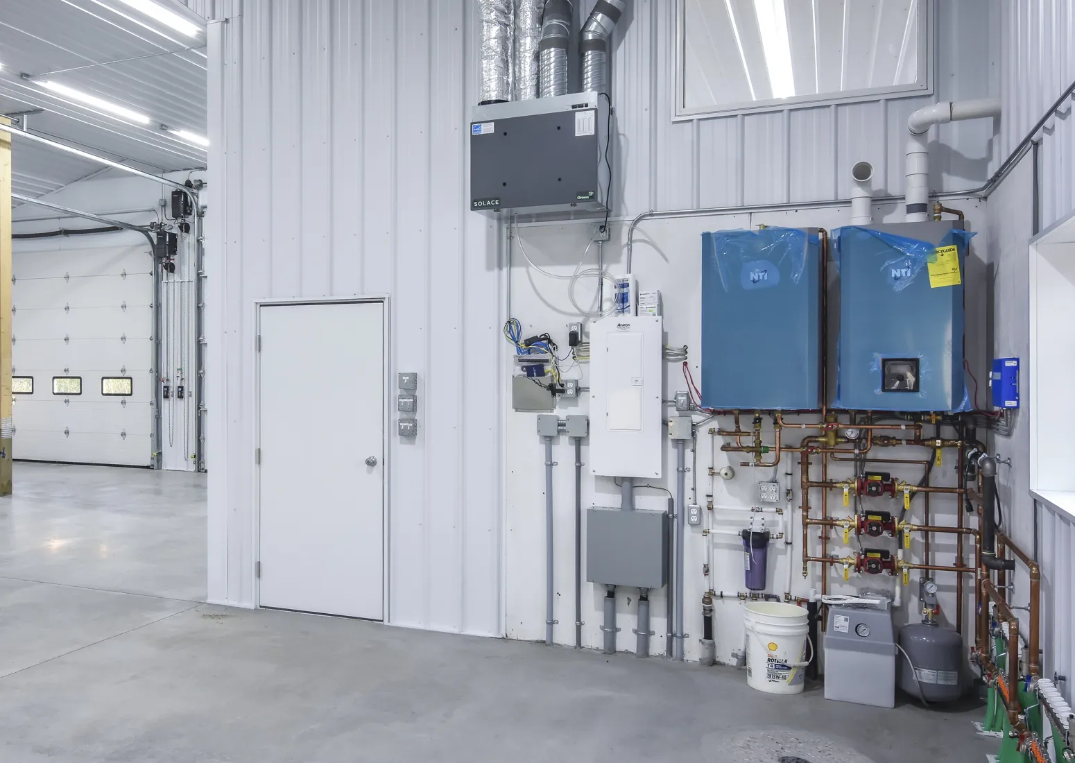 Post frame building integrates electrical and concrete services into the initial construction.