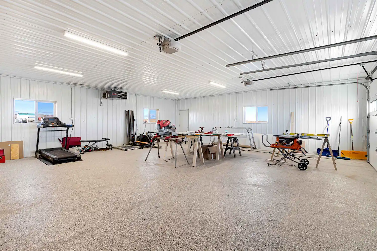 Attached 2 car barndominium garage being used as a workshop