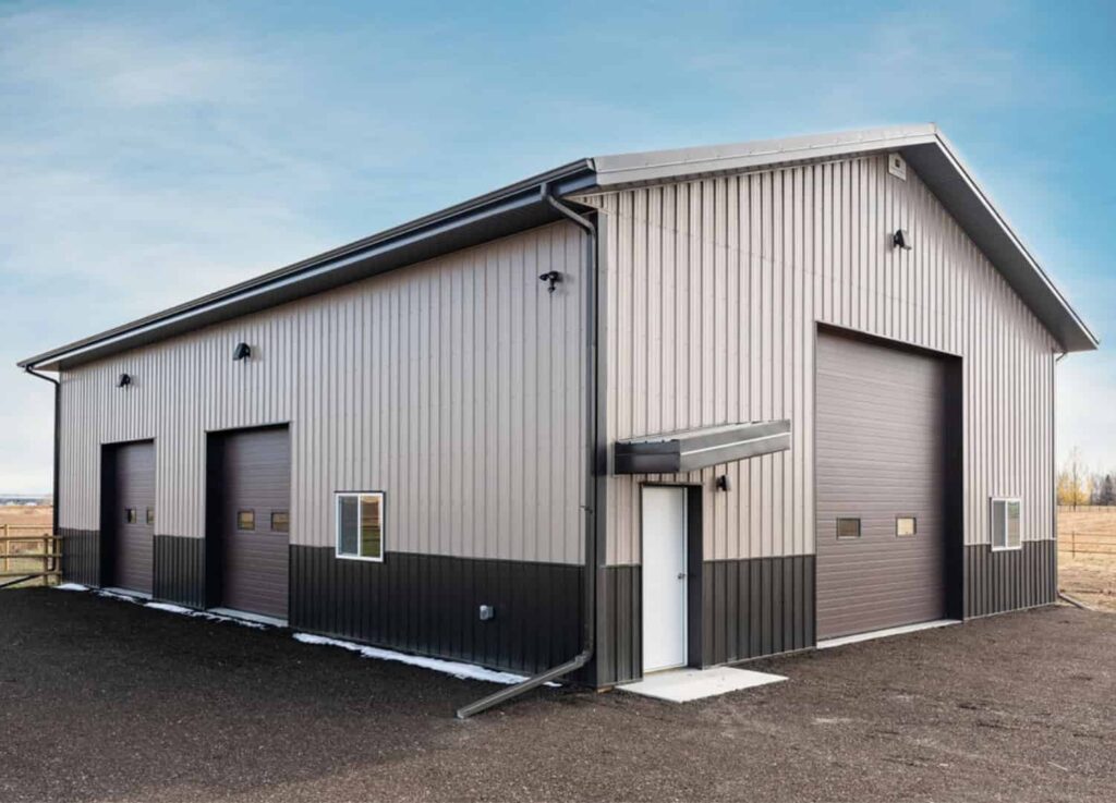 Brown Post Frame Building With Eyebrow Detail And Dark Wainscoting