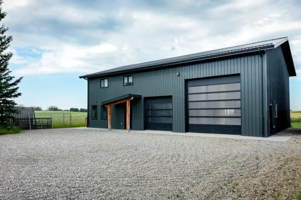 Post Frame Outbuilding With Large Overhead Doors On An Acreage
