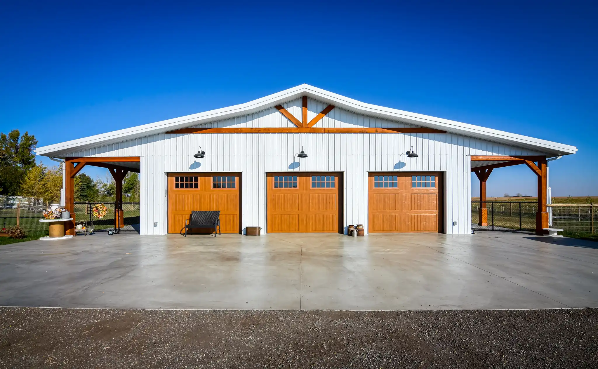3 car garage attached to a single story barndominium