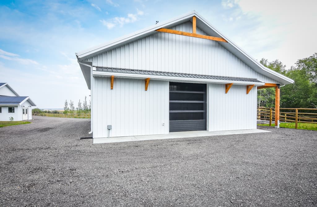 Whit equine facility used as a pole barn for horses