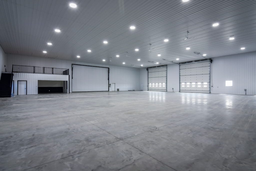 Concrete floor placed inside a large agricultural shop
